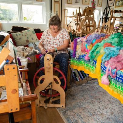 Christine Casey weaving in her studio (Kiri Cottage Crafts)
