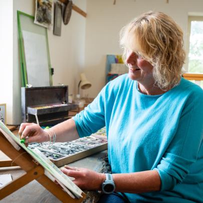 Sara Brown Artist working in her studio
