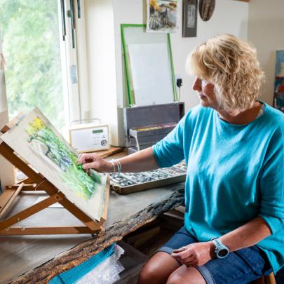 Sara Brown Artist working in her studio